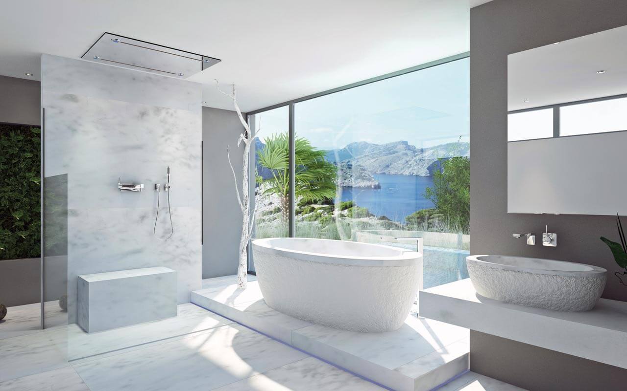 Ein luxuriöses weißes Badezimmer vor einem atemberaubenden Meerblick.