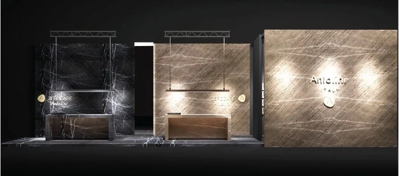 Verfeinerung und Innovation für Küchenräume mit imposanten skulpturalen Dimensionen Auf der IMM 2019 präsentiert Antolini ein beeindruckendes Display, das die Ausdrucksintensität von Naturstein steigert und sich gleichzeitig auf innovative Technologien konzentriert. Antolini, führend in der Herstellung von Naturstein und an der absoluten Spitze der Branche, nimmt an der IMM Cologne mit einer hoch entwickelten Installation des Designers Alessandro La Spada teil. Das harmonische und elegante Ausstellungsdisplay umfasst zwei Küchenblöcke, einer aus Bronze Amani und der andere aus Gray Stone: Wenn das erste Material mit seinen warmen, weichen, zarten Beige- und Cappuccino-Tönen fasziniert, die mit dunkleren Adern durchdrungen werden, überrascht das zweite Material durch seine flüchtige Persönlichkeit die verschiedene Grautöne mit schwer fassbaren weißen Adern abwechselt und ein abstraktes Design präsentiert, das so einzigartig ist, wie es nur die Natur bieten kann. Beide Küchenblöcke zeichnen sich durch eine lineare und geometrische Eleganz aus und verfügen über eine Schiebebrücke, die ihre Oberfläche verdoppelt und eine weitere verdeckte Oberfläche auf magische Weise enthüllt. Das Material von Amani Bronze und Grey Stone, das für die auf der IMM gezeigten Küchen verwendet wurde, wurde mit Azerocare behandelt. Azerocare wurde von Antolini patentiert und wurde speziell für Marmor, Onyx und weiche Quarzite entwickelt. Es handelt sich um eine revolutionäre Behandlung, die maximalen Schutz gegen Flecken und Ätzen durch Kontakt mit Nahrungsmitteln und sauren Substanzen garantiert. Azerocare wird von Antolini direkt auf die Plattenoberflächen aufgetragen und ist eine Garantie gegen mögliche Schäden, die durch die Verwendung von Produkten wie Wein, Kaffee, Öl, Essig, Tomatensauce und Fruchtsäften entstehen können, und ist daher die ideale Lösung für Oberflächen in Küchenumgebungen . Der elegante, graue Steinboden (Leder) vervollständigt das Gesamtbild und gibt der Installation ein Gefühl von Einheit. Über den Küchenblöcken ragen zwei lange Deckenleuchten mit Bronze- und gebürstetem Stahlüberzug hervor. Dahinter und auf einer Seite befinden sich die majestätischen und markanten Wände aus Gray Stone I Stratos Design und Bronze Amani I Stratos Design, die zart von geräucherten Spiegeln unterbrochen werden, die die Pracht des Steins mit überraschendem Stil widerspiegeln.