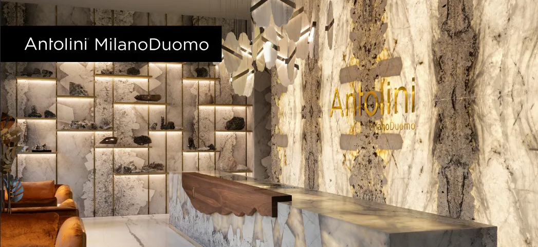 Antolini MilanoDuomo Showroom in Mailand – luxuriöse Natursteinwände mit hinterleuchteten Strukturen, edle Materialien und modernes Interior Design.